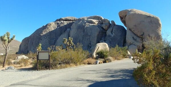 Joshua Tree campground entrance with a huge rock in the back